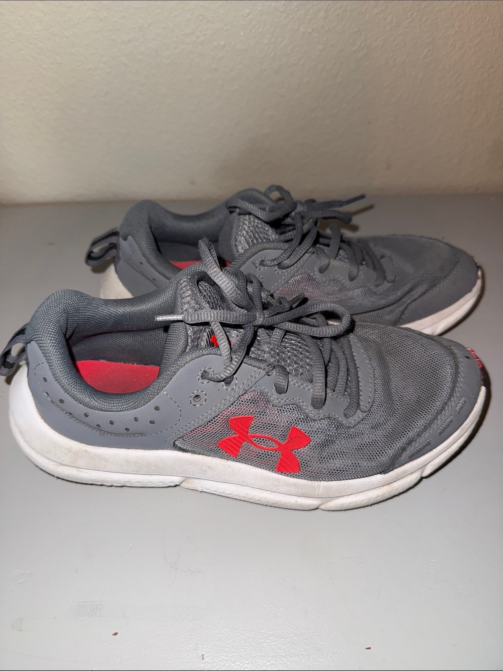 Under Armour Kids Gray Sneakers with Red Logo